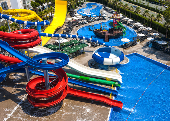 Colourful water slides and swimming pools at a family water park near Golem, Albania.