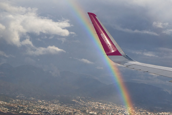Passenger plane flying to Tirana through the clouds